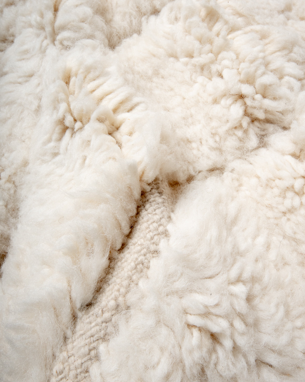 Modern, designer, handcrafted Berber rug from Morocco. Beniourain carpet with minimalist design, natural wool pile and a fluffy texture.